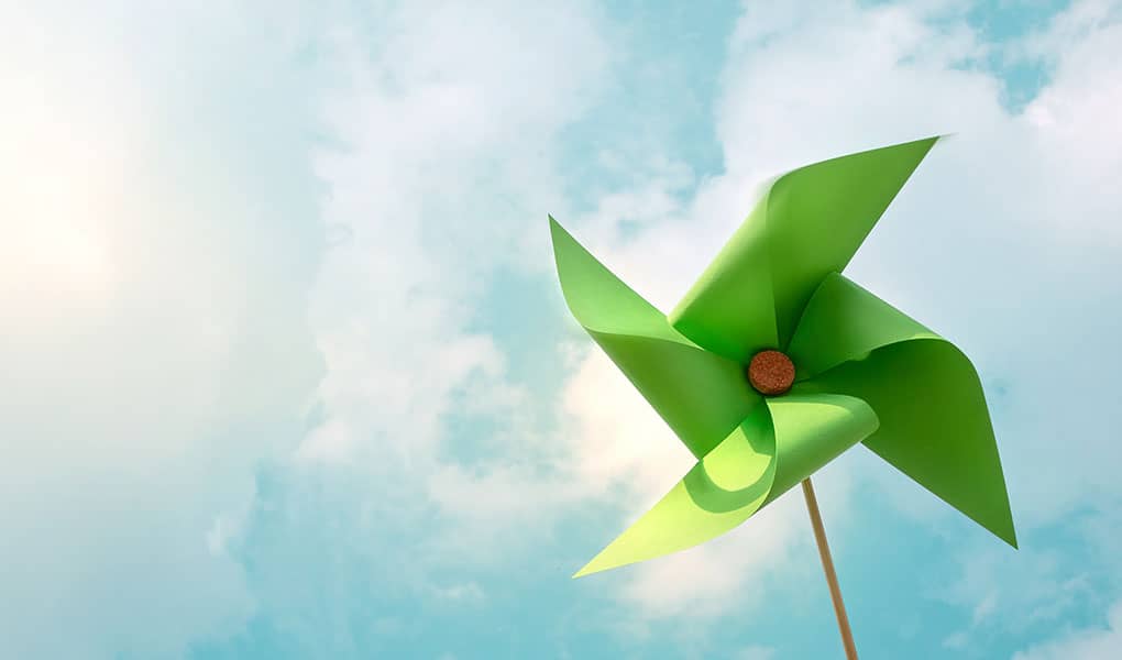 Paper windmill against blue sky