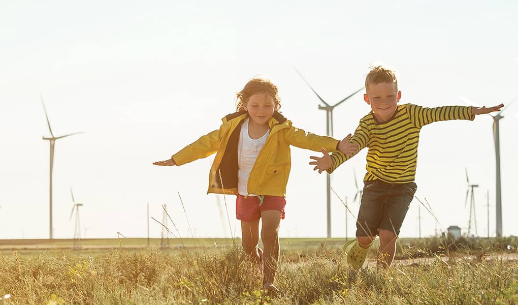 Children playing near windfarm