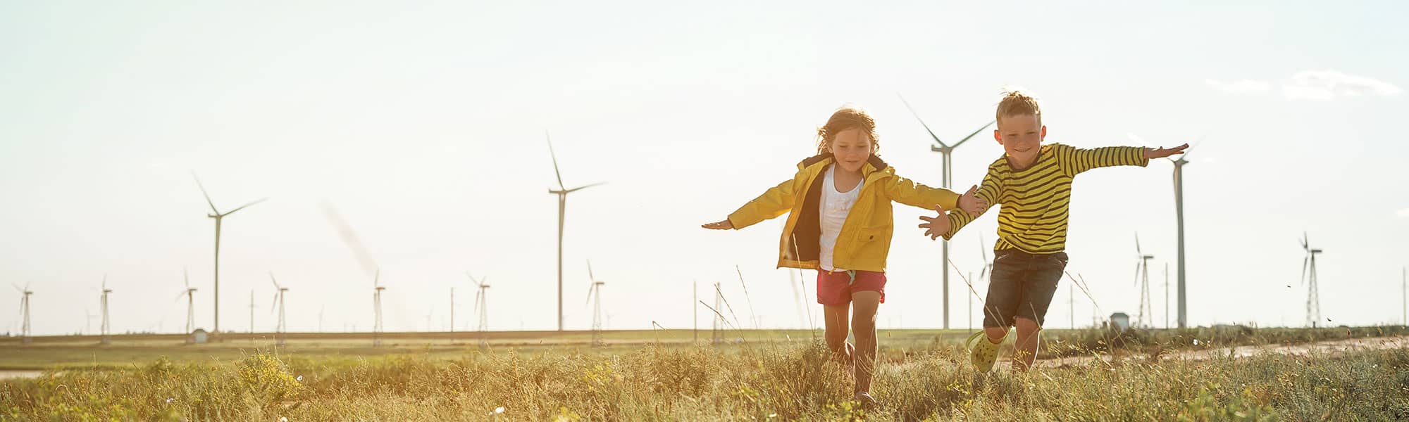 Children playing near windfarm